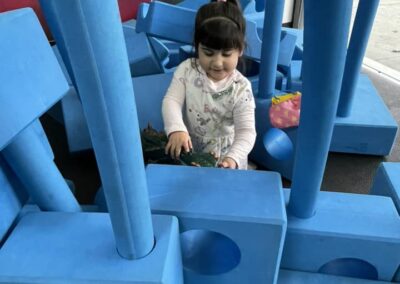 little girl with Big Blue Blocks